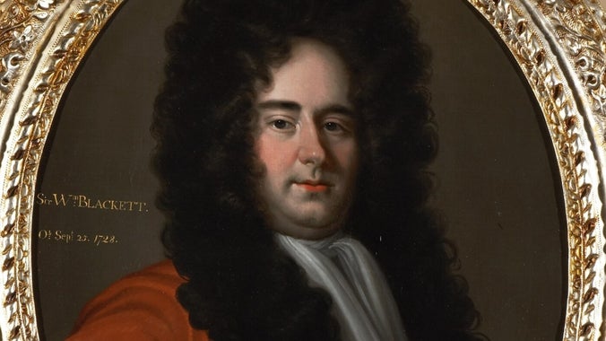 A head-and-shoulders portrait of a man turned slightly to the right, gazing at the spectator, in a long black wig and red coat and white stock.